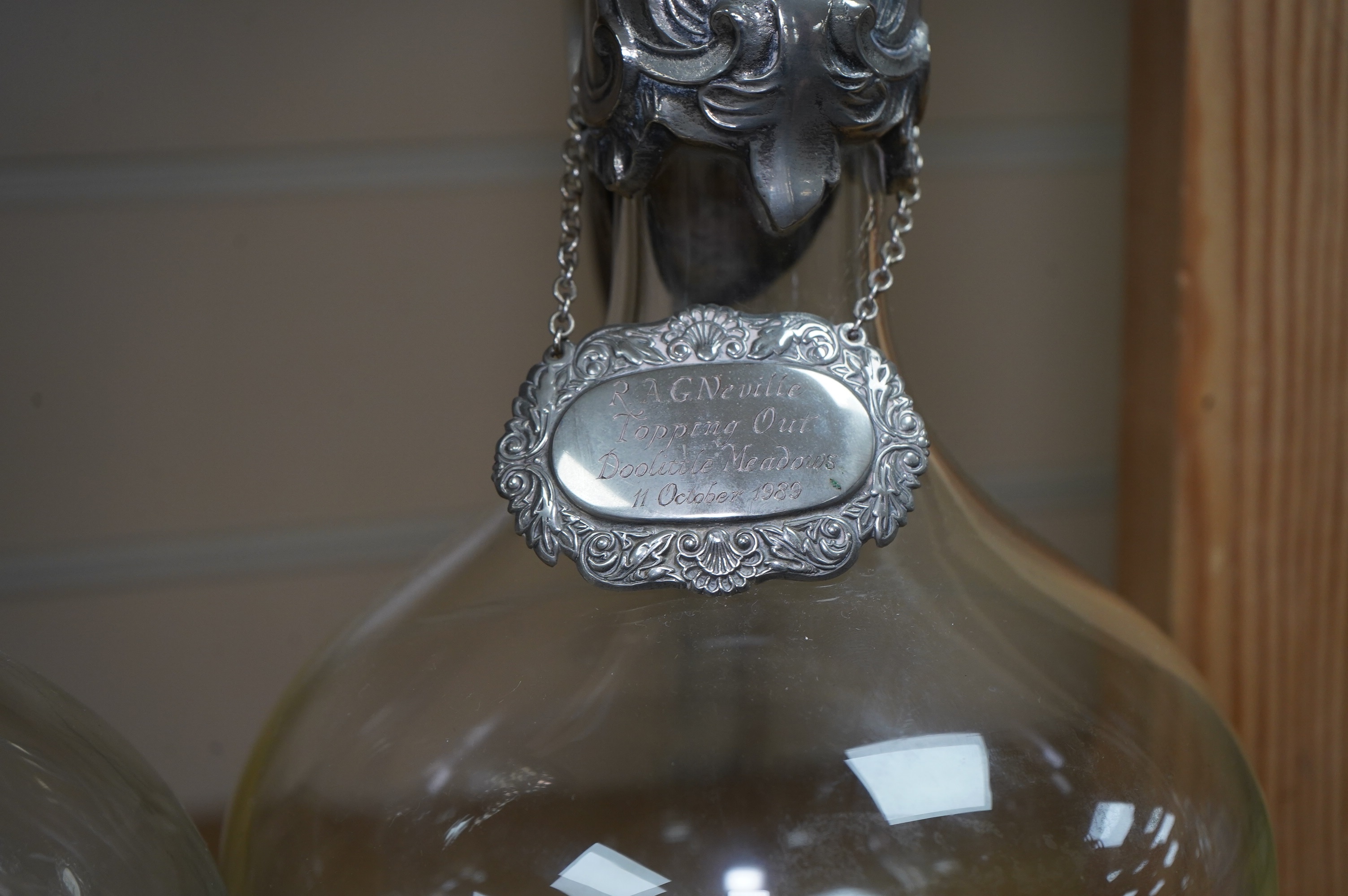 A pair of Art Nouveau silver plate mounted claret jugs with labels, 32cm. Condition - fair to good